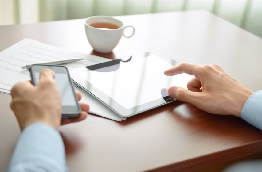 Person streaming on a tablet in a hotel room